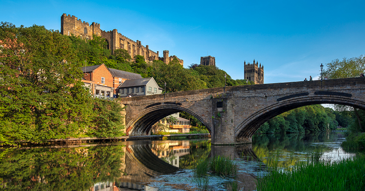View of Durham Castle and Cathedral from the banks of the River Wear in Durham City centre